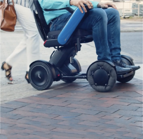 a person in a WHILL power chair